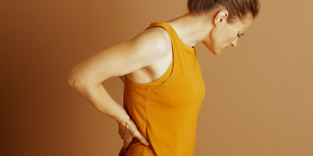Persona con dolor lumbar que limita sus actividades cotidianas.